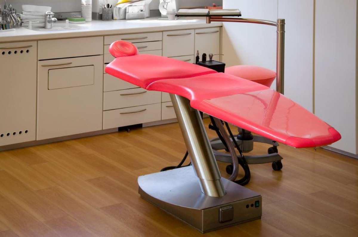 A dental treatment room seen from the doorway