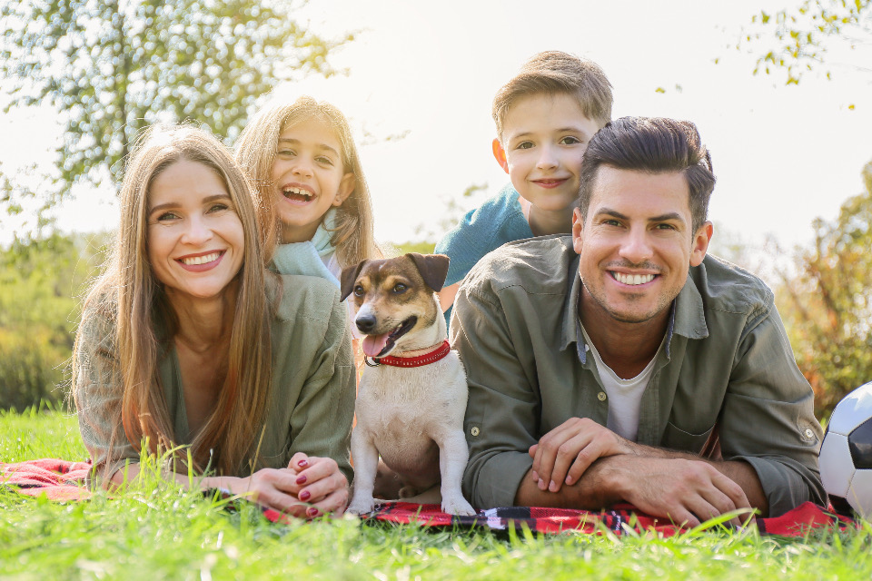 A family sitting together outdoors
